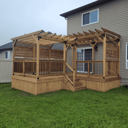 L-shaped pressure-treated pergola with privacy panels in backyard, Almonte