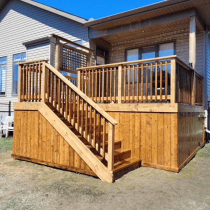 Pressure-treated deck with privacy panel in Almonte