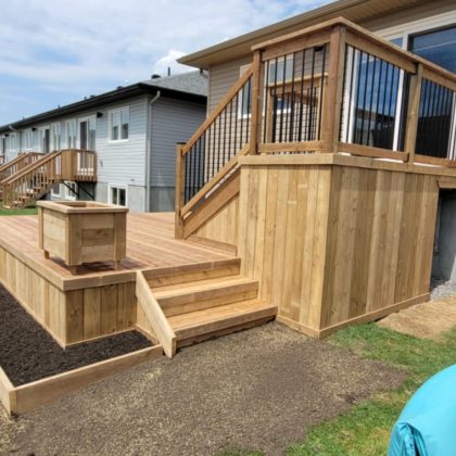 Cedar deck with aluminum balusters and planter box in Arnprior