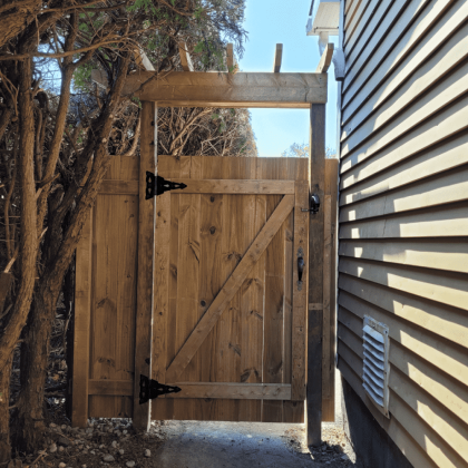 Pressure-treated gate against house in Ottawa