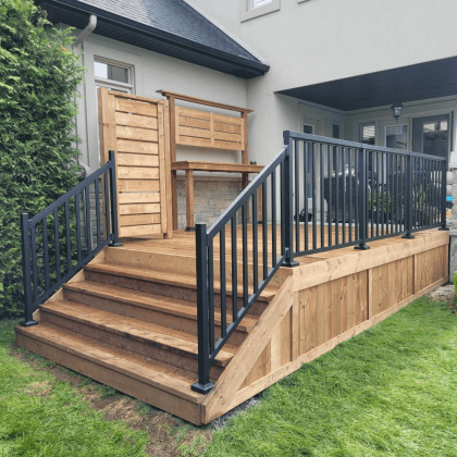 Pressure-treated deck with aluminum railing in Stittsville